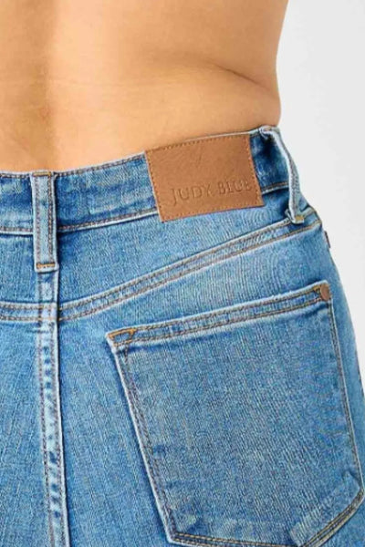 Close-up of the front waist area, highlighting the high-waisted design of Judy Blue flare jeans.
