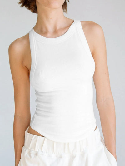 White asymmetrical back ribbed crop tank top for women, designed with a fitted silhouette and ribbed texture, ideal for casual wear or layering in warmer weather