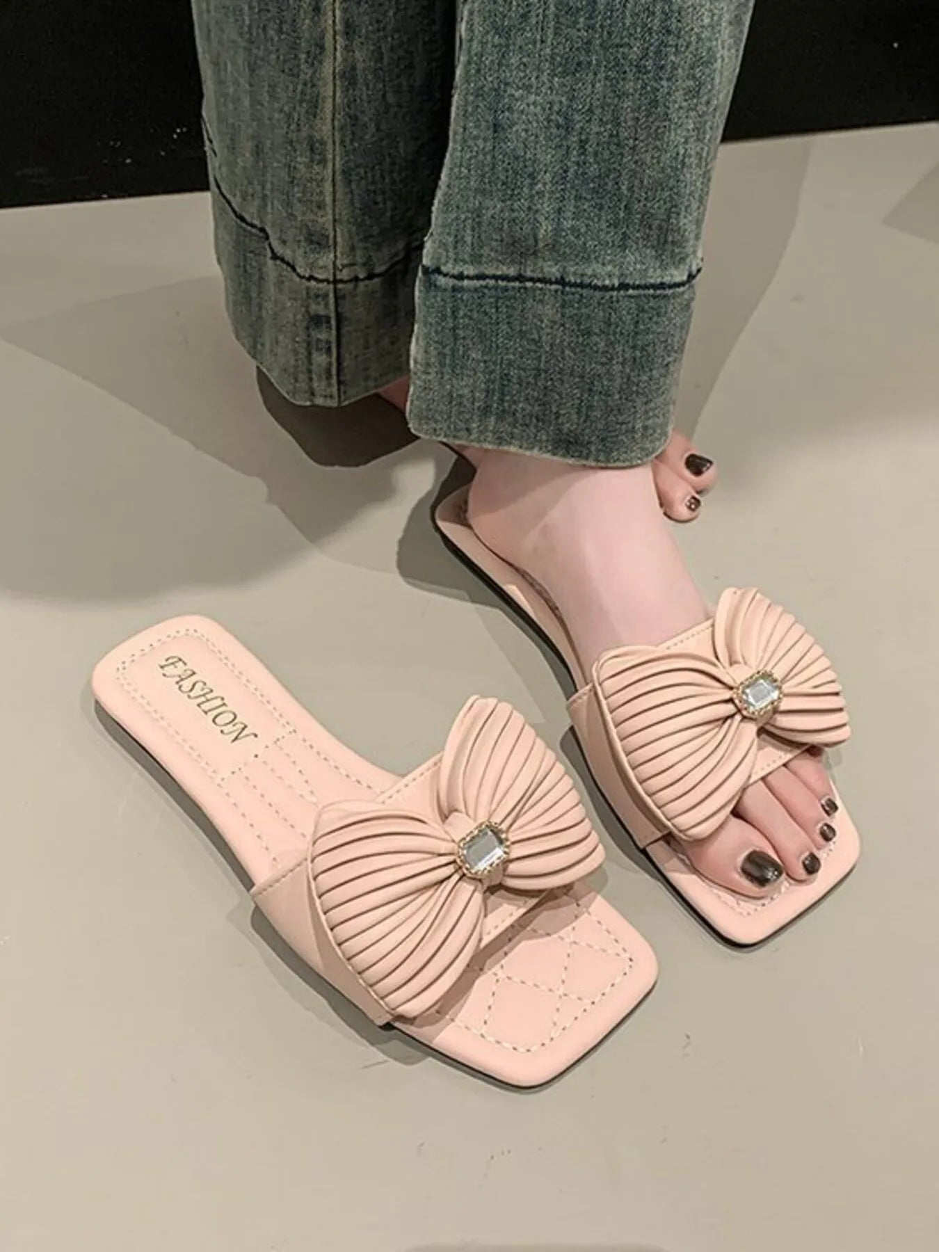 Complete look of Bow Knot Flat Sandals on model, highlighting their stylish and comfortable design.