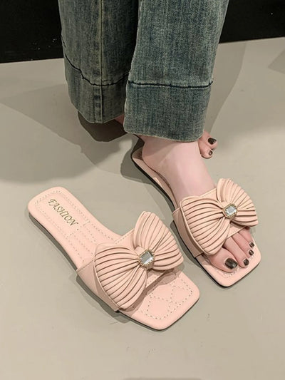 Complete look of Bow Knot Flat Sandals on model, highlighting their stylish and comfortable design.