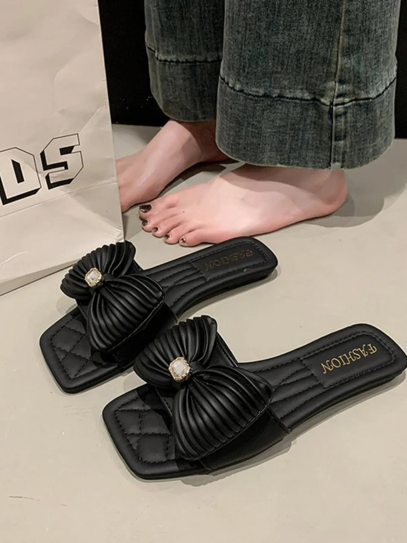 Close-up of the sole on Bow Knot Flat Sandals, highlighting the flat and comfortable design.