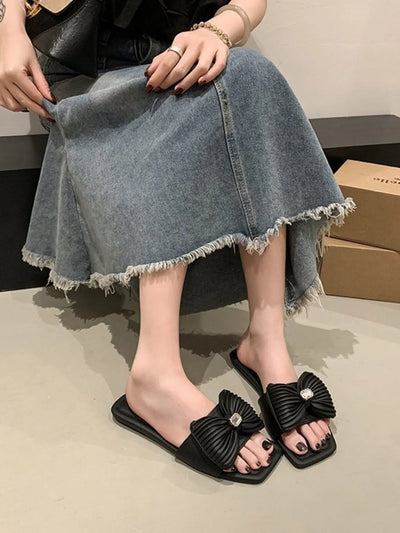 Pink bow knot flat sandals for women, featuring a stylish bow detail and comfortable flat sole, perfect for casual summer outfits