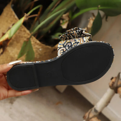 Side view of multicolor floral bow printed open-toe flat sandals for women, featuring a vibrant floral design and stylish bow detail, ideal for casual summer wear