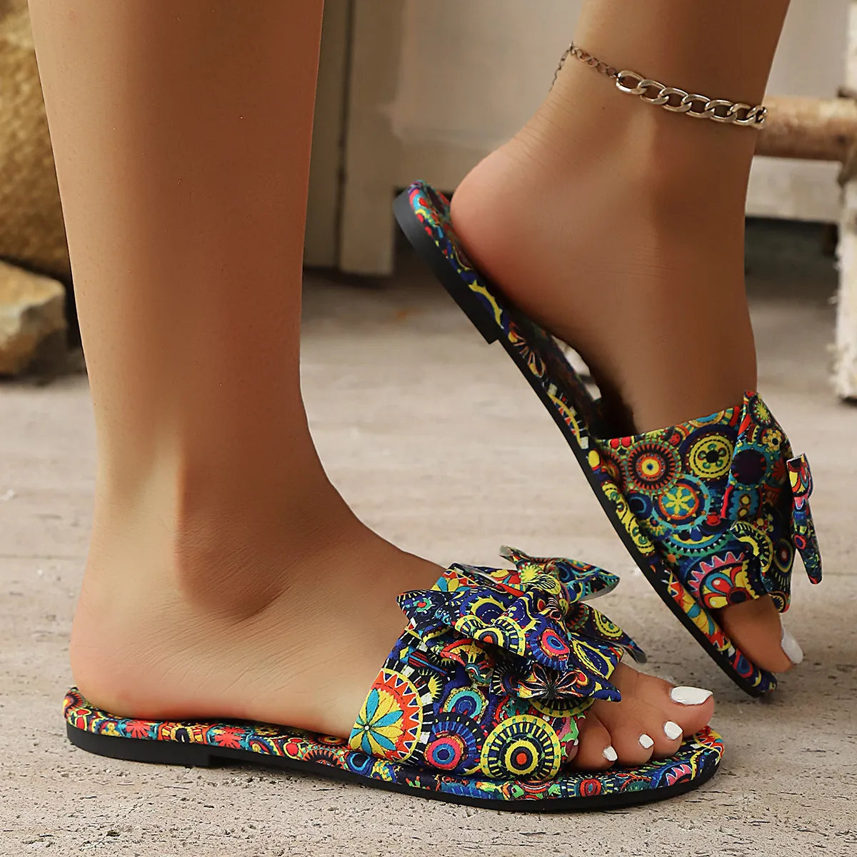 Colorful multicolor bow printed open-toe sandals for women, featuring vibrant floral design, flat comfortable sandals perfect for casual summer wear
