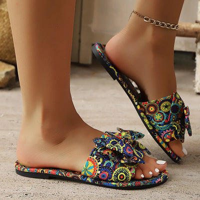 Colorful multicolor bow printed open-toe sandals for women, featuring vibrant floral design, flat comfortable sandals perfect for casual summer wear