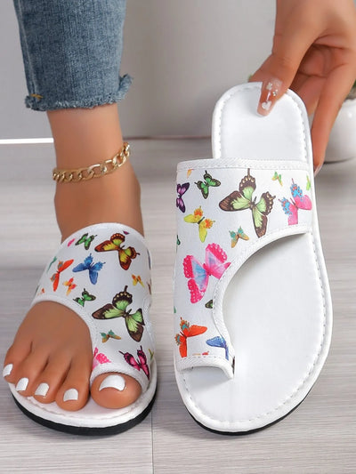 Front view of Butterfly Print Comfort Slide Sandals, featuring vibrant butterfly print and slip-on design.