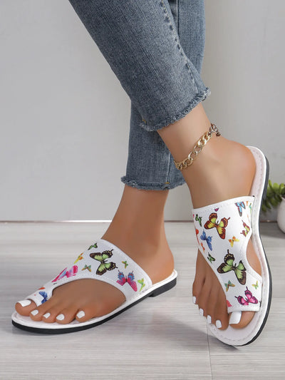 Side view of Butterfly Print Comfort Slide Sandals, showcasing the cushioned sole and stylish design.