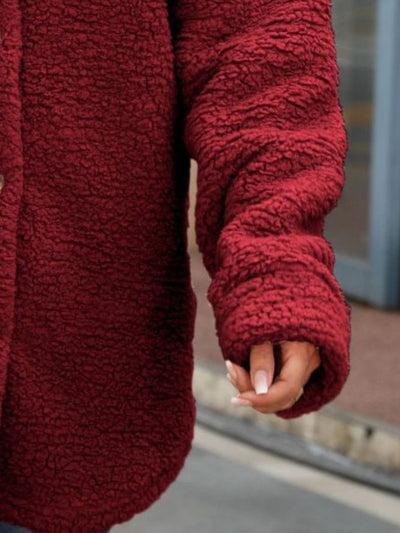 Model wearing Button Down Collared Coat, showcasing the overall fit, collar design, and elegant style.