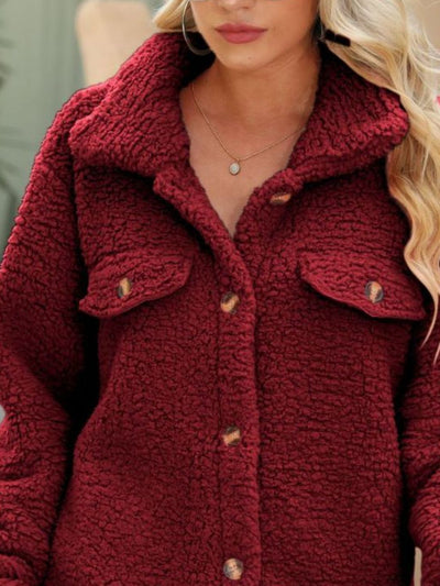 Close-up of the pocket details on Button Down Collared Coat, showcasing the functional design and neat stitching.