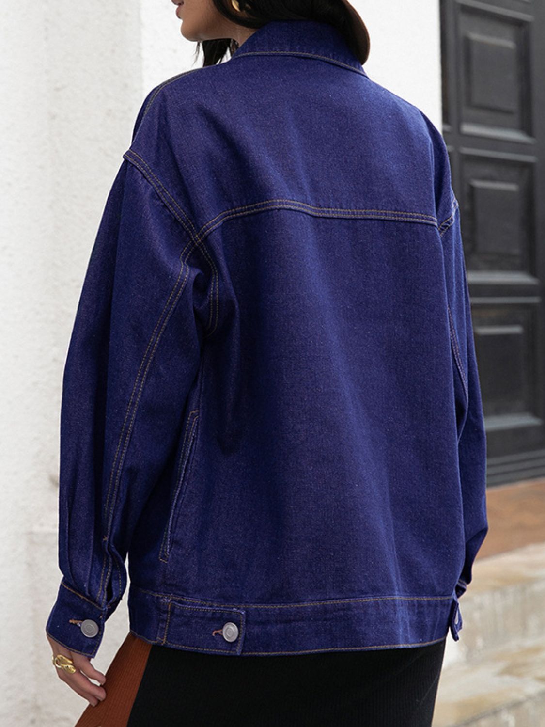 Side view of Buttoned Denim Jacket, showing sleeve design and relaxed silhouette.
