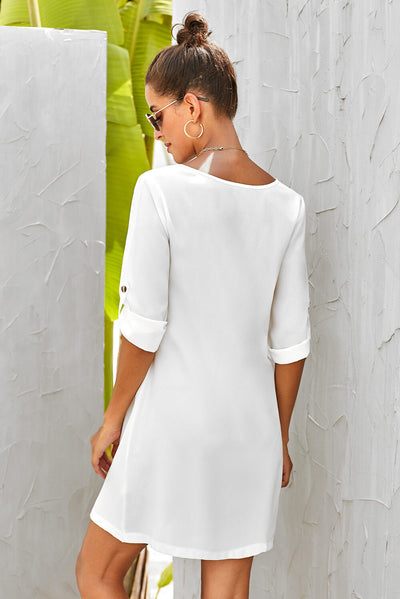 Side view of Buttoned V-Neck Dress, showcasing fitted waist and flowing skirt.