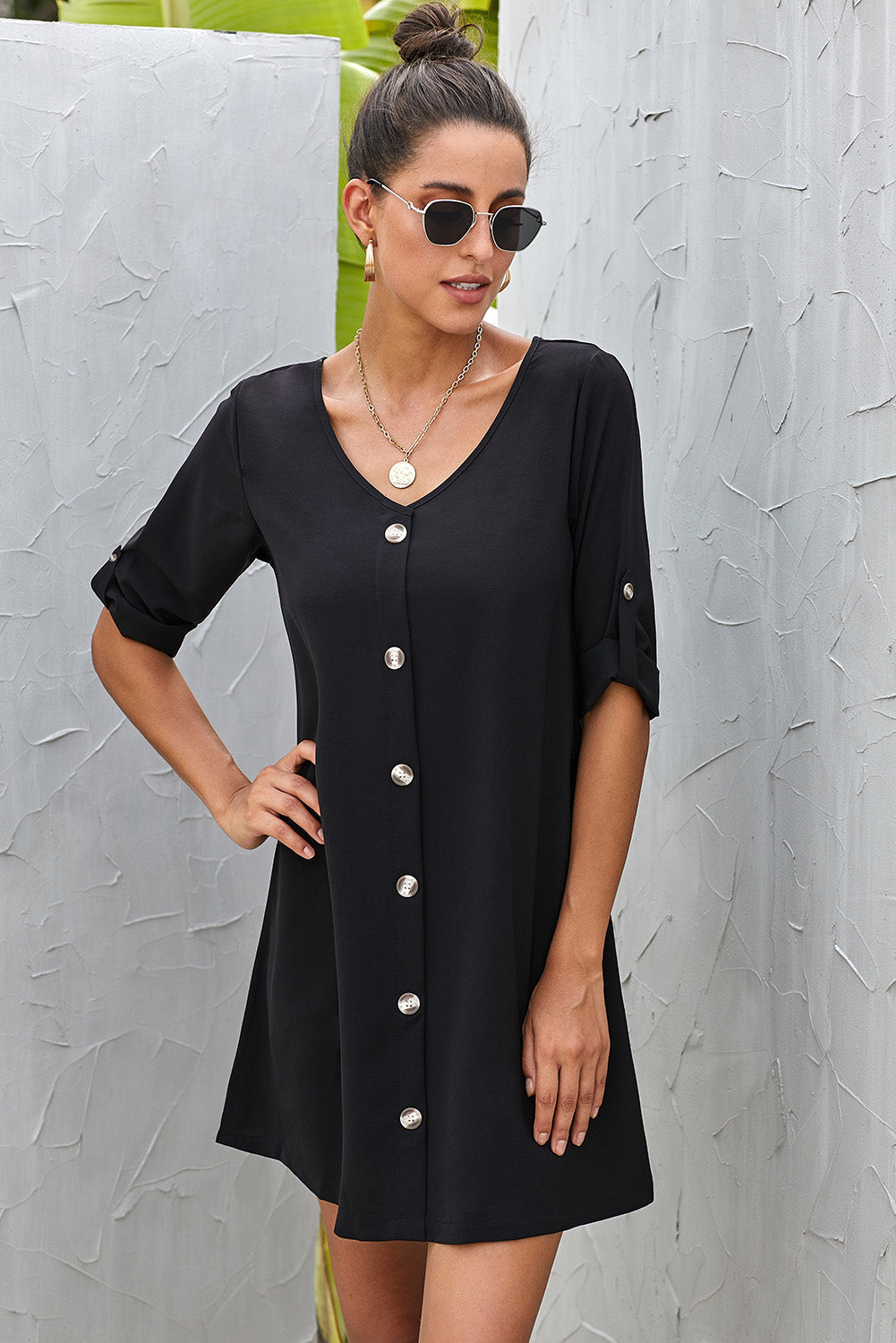 Close-up side view of Buttoned V-Neck Dress, highlighting waistline and flowing silhouette.