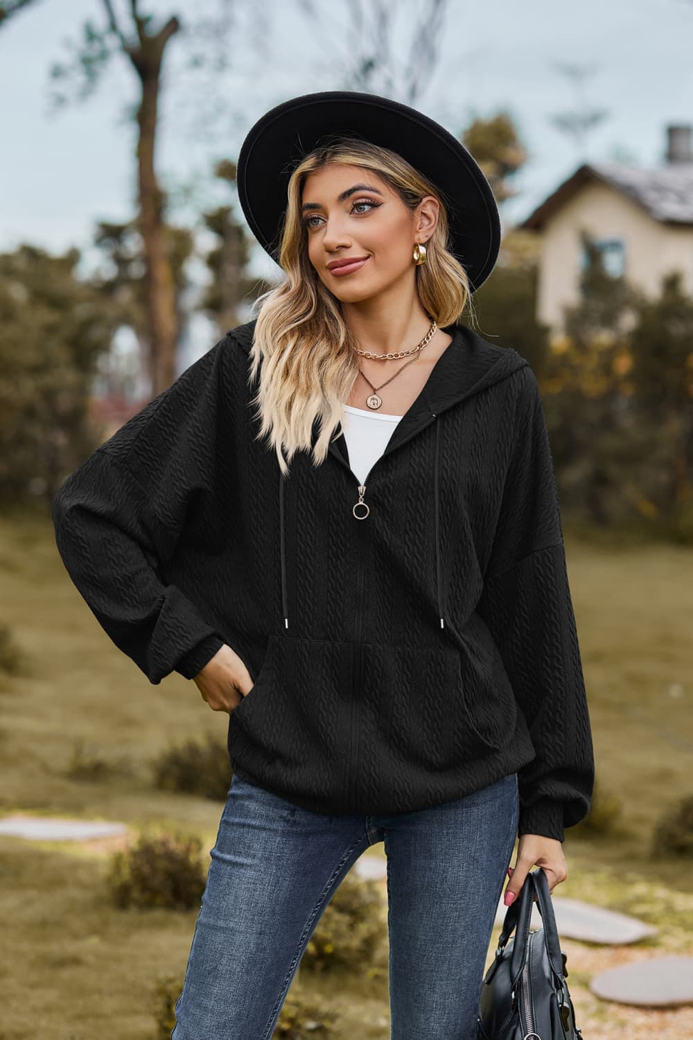 Model showcasing Cable Knit Long Sleeve Hooded Jacket, styled with casual outfit and cozy design.