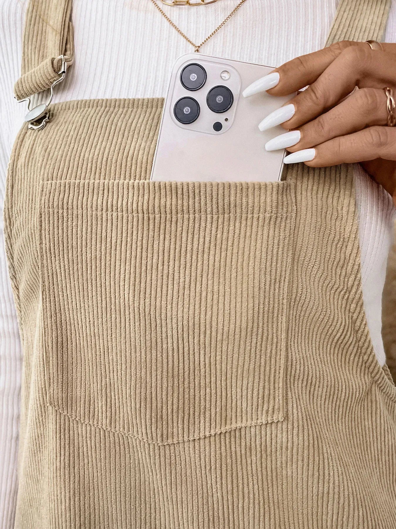 Close-up of the front pocket on Corduroy Overall Dress, highlighting its large size and functional design.