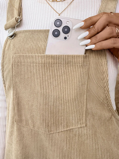 Close-up of the front pocket on Corduroy Overall Dress, highlighting its large size and functional design.