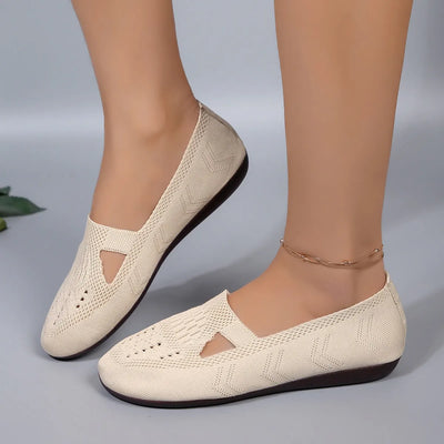 Model wearing Cutout Mesh Slip-Ons, showcasing fit, breathable mesh, and casual style