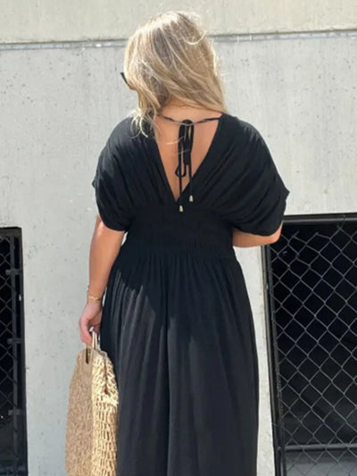 Back view of Full Size Deep V-Neck Maxi Dress with Side Slit, highlighting the open back design and floor-length style.