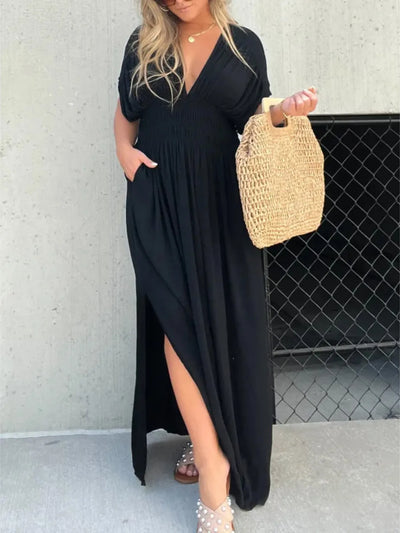 Front view of Full Size Deep V-Neck Maxi Dress with Side Slit in black, featuring a deep V-neckline and flowing maxi length for plus-size women.