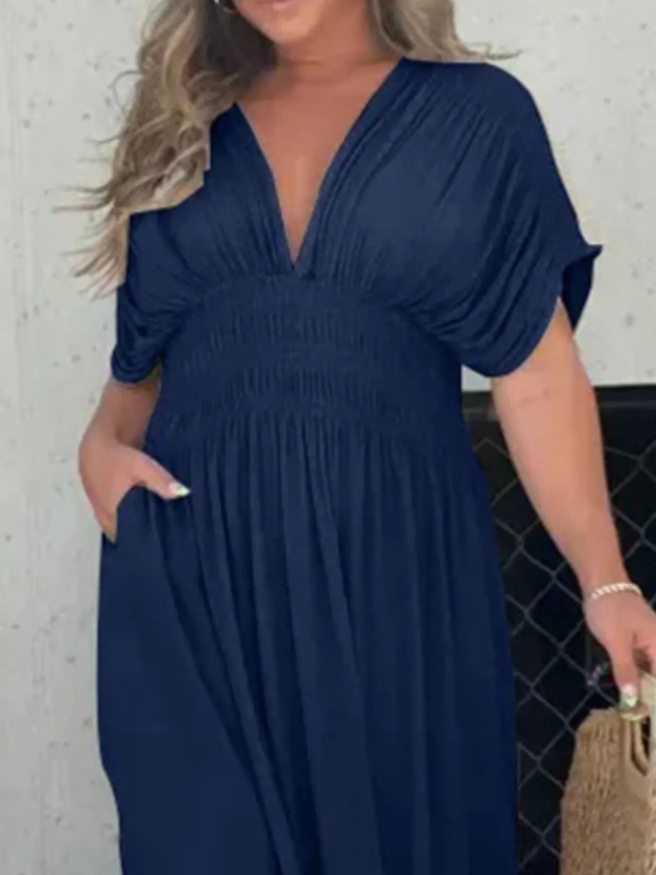 Full-length view of model wearing Full Size Deep V-Neck Maxi Dress with Side Slit, showing overall flow and slit detail.
