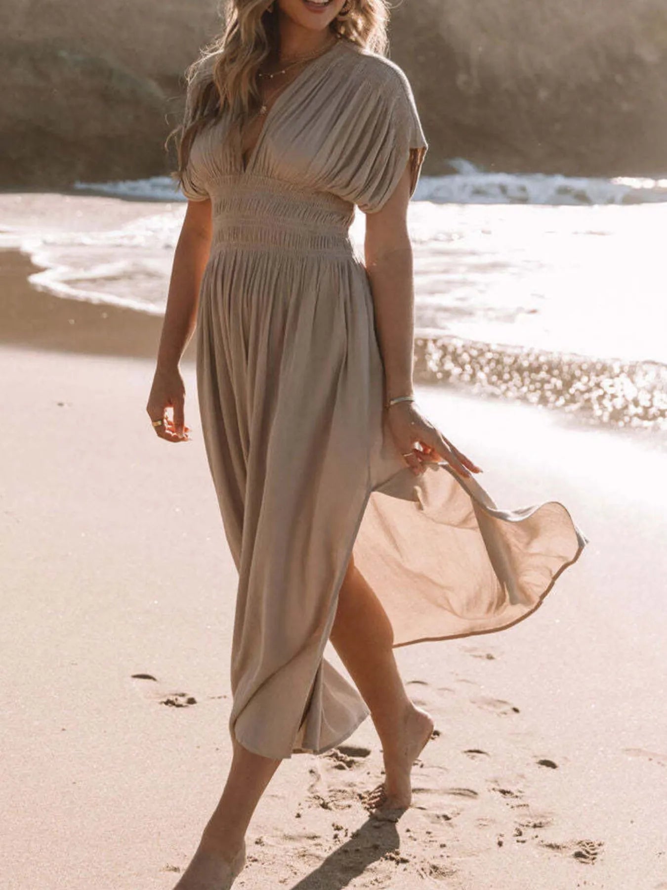 Close-up of the side slit on Full Size Deep V-Neck Maxi Dress, showcasing the flowing design and slit detail.