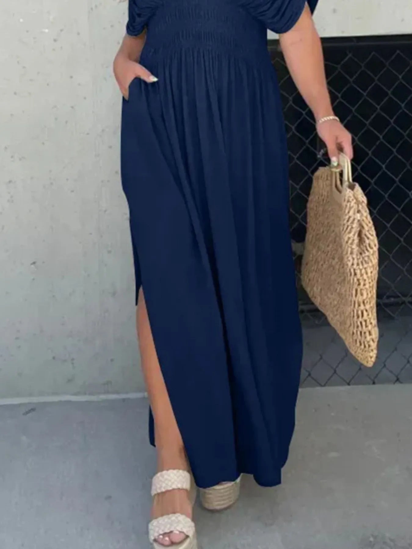 Styled view of Full Size Deep V-Neck Maxi Dress with Side Slit, paired with accessories, highlighting elegant plus-size fit.