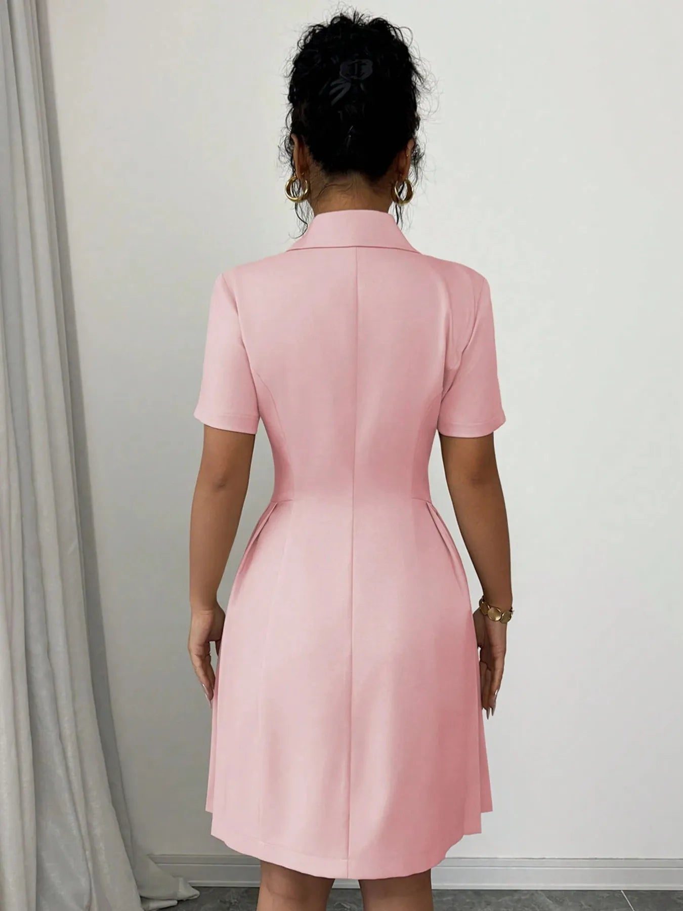 Close-up of the buttons and stitching on Double Breasted Short Sleeve Dress, showing premium tailoring.