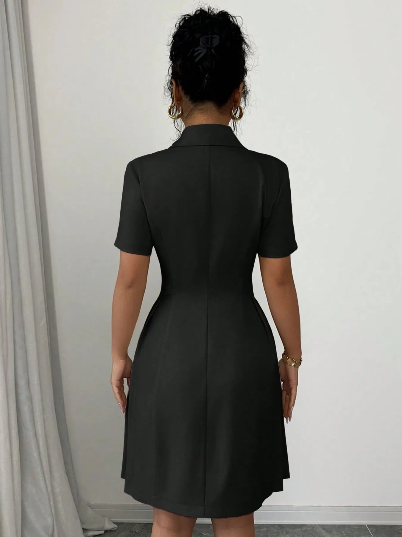 Close-up of the double-breasted buttons on Double Breasted Short Sleeve Dress, highlighting design details and quality.