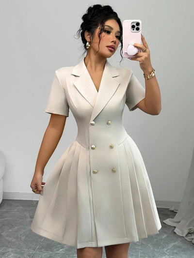 Close-up of the hemline on Double Breasted Short Sleeve Dress, showcasing clean finish and fabric texture.