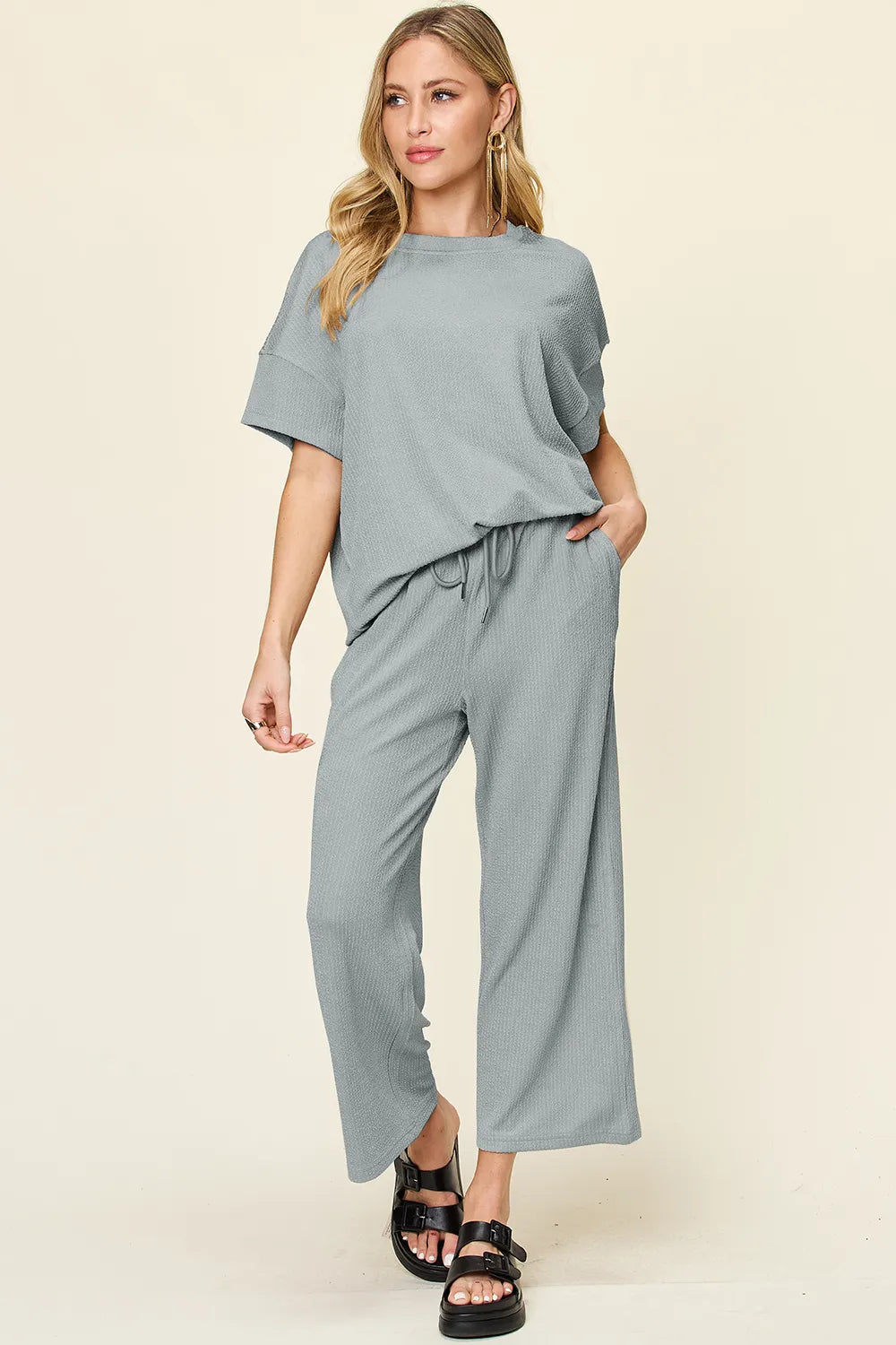 Close-up of fabric texture of Double Take Texture T-Shirt and Wide Leg Pants, showcasing softness and quality.