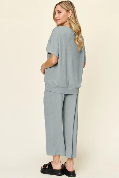 Angled front view of Double Take Texture Set on model, showing T-shirt and pants relaxed fit.