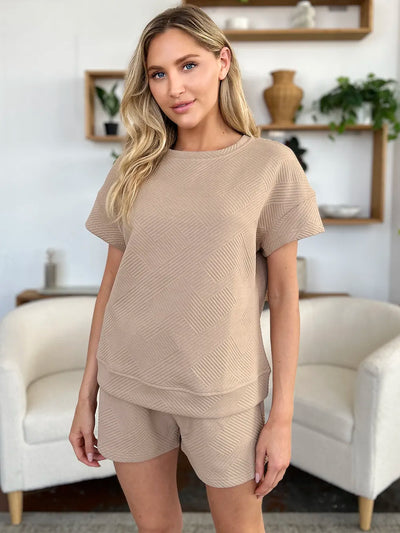 Front view of model wearing Double Take Full Size Texture Short Sleeve T-Shirt and Drawstring Shorts Set, showing overall fit.