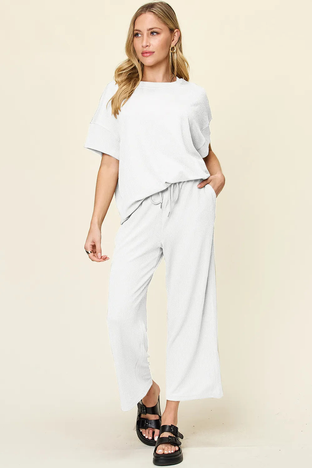 Front view of wide-leg pants on model, highlighting flowy design and waistband in Double Take Texture Set.
