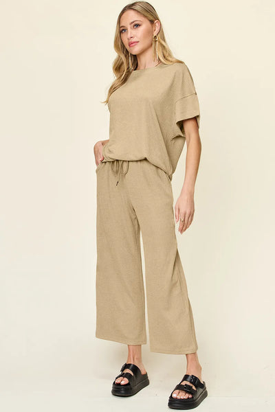 Side angle view of wide-leg pants in Double Take Texture Set, highlighting flowy silhouette and waistband.