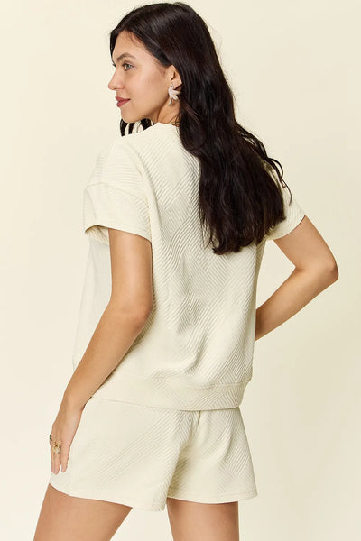 side close-up of Double Take Texture Set on model, highlighting T-shirt and shorts silhouette.