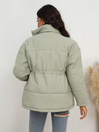 Side view of Drawstring Waist Zip-Up Puffer Jacket, showing the puffer design and relaxed fit for warmth and comfort.