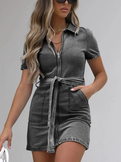 Full-body view of plus-size model wearing Full Size Zip-Front Short Sleeve Denim Dress, showing overall fit and styling.