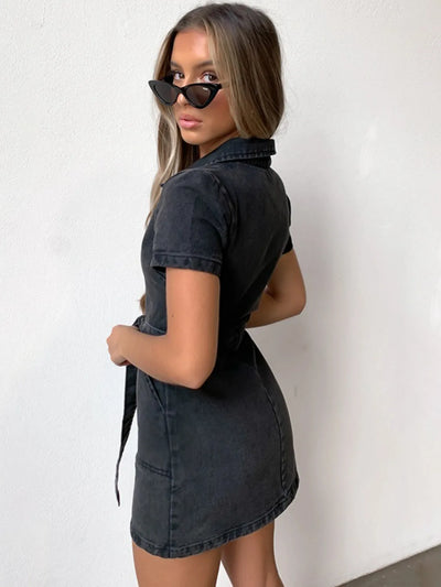 f103929e-7138-4612-a999-9fb8d9db5Side view of Full Size Zip-Front Short Sleeve Denim Dress worn by model, emphasizing the fitted waist and straight skirt.789-Max-Origin