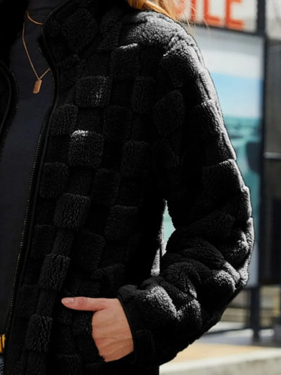 Detailed view of the sleeves of Fuzzy Checkered Zip-Up Jacket, highlighting the relaxed fit and fuzzy texture.