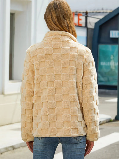Close-up of the zipper on Fuzzy Checkered Zip-Up Jacket, emphasizing easy zip functionality.