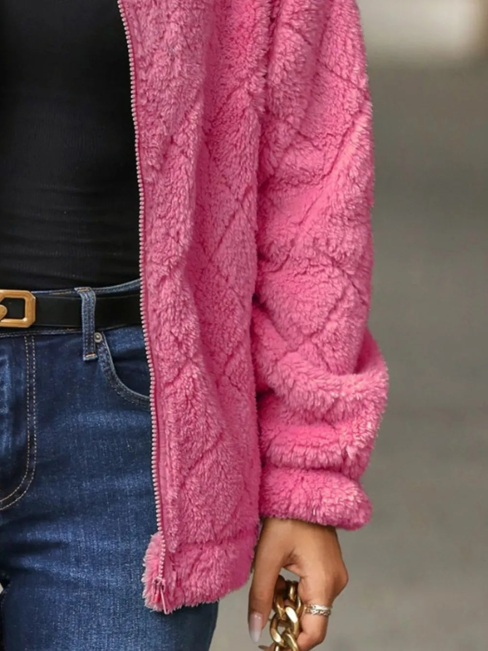 Close-up of the back texture of Fuzzy Pocketed Zip-Up Jacket, highlighting the soft fuzzy fabric and fit.