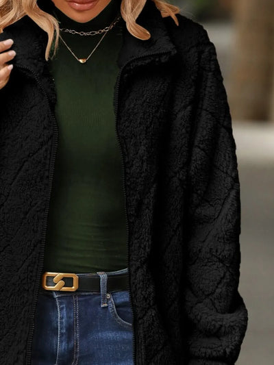 Close-up of the front texture of Fuzzy Pocketed Zip-Up Jacket, emphasizing the soft fuzzy material.