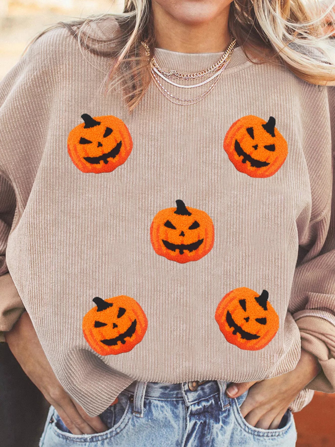 Model wearing the Halloween Pumpkin Drop Shoulder Sweatshirt, displaying the front pumpkin print and overall relaxed style.