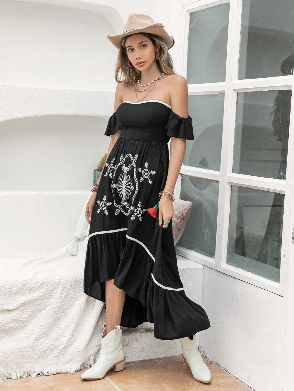 Close-up of the fabric and off-shoulder detailing of the High-Low Off-Shoulder Dress, emphasizing the quality and design.