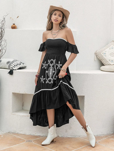 Side view of the High-Low Off-Shoulder Dress, showing the asymmetrical hem and elegant flow of the fabric.