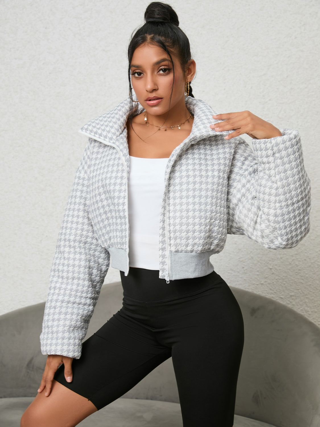 Front view of the Houndstooth Zip-Up Jacket in black and white, featuring a classic houndstooth pattern and full zip closure.