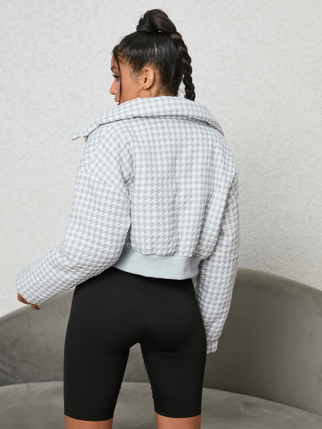 Side view of the Houndstooth Zip-Up Jacket, showing the fitted silhouette and zippered front for a stylish casual look.