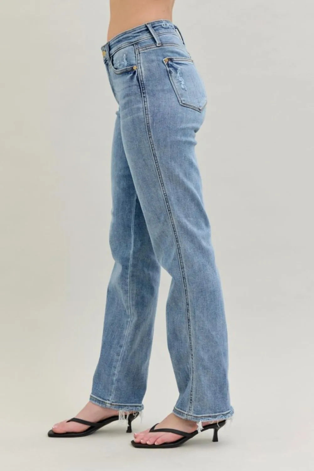 Close-up of the frayed hem and cell phone pocket detailing on Judy Blue Frayed Hem Cell Phone Pocket Dad Jeans, emphasizing the practical design.