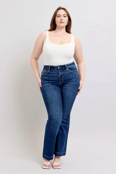 Plus-size model wearing Judy Blue High-Rise Flare Jeans with pockets, showcasing the flattering flare silhouette and high-rise waist.