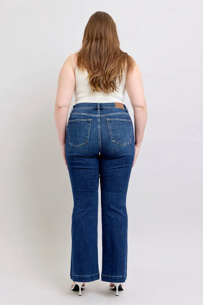 Side view of Judy Blue Full Size High-Rise Flare Jeans with pockets, highlighting the classic flare cut and high-waisted fit.