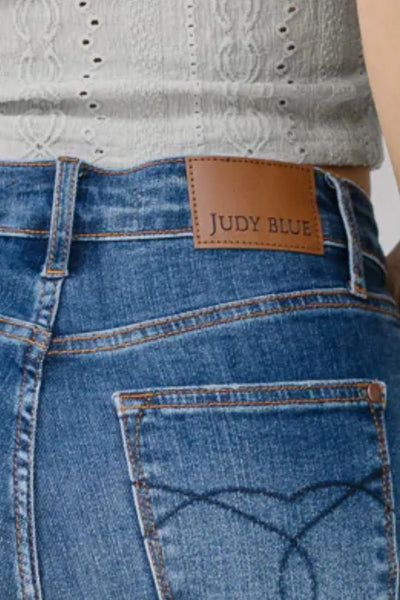 Model wearing Judy Blue High Waist Back Pocket Embroidery Crop Wide Jeans from the front.